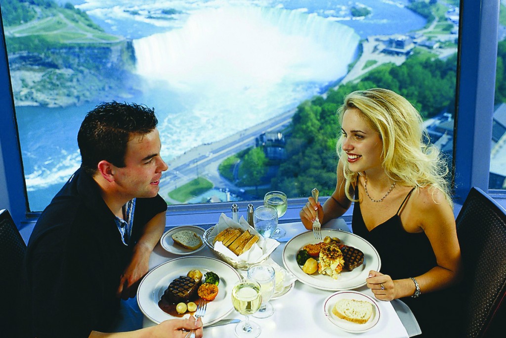 Couple eating dinner at the revolving dining room at Skylon Towers